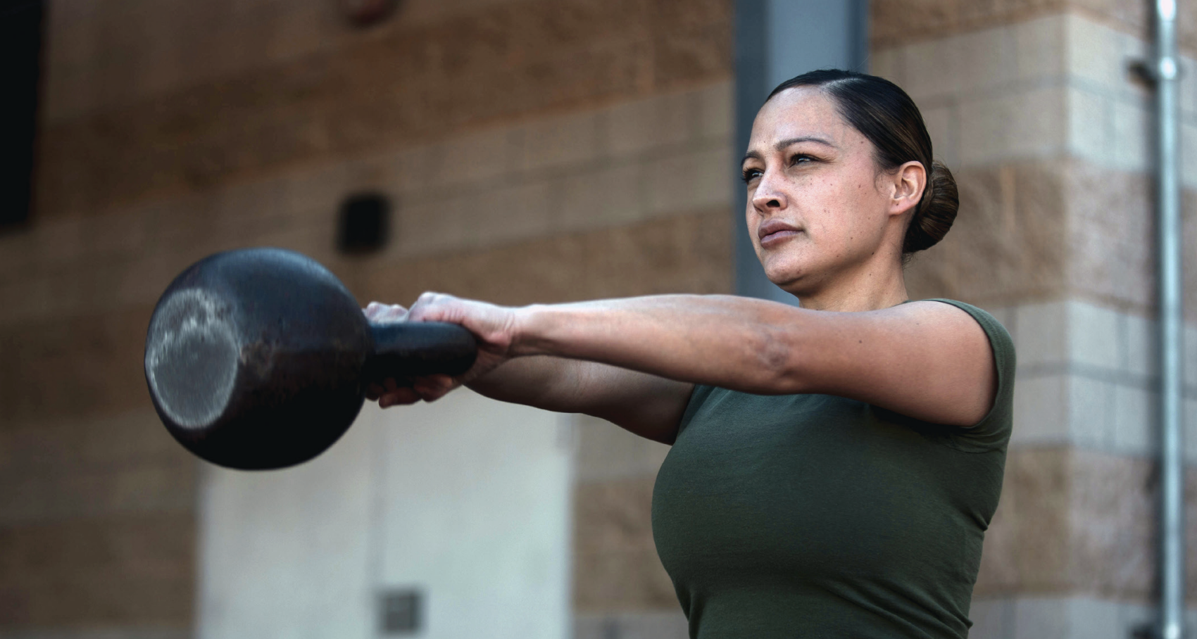 Marine Gunnery Sergeant Meagan Barragan, administrative specialist with Headquarters and Support Battalion, Marine Corps Base CampPendleton, swings kettlebell at Paige Field House on Camp Pendleton, California, February 7, 2022 (U.S. Marine Corps/Shaina Jupiter))
